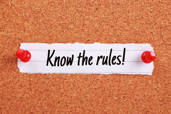 Paper tacked on corkboard reads "Know the rules!"